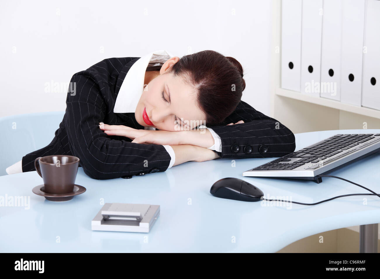 Beauty caucasian businesswoman sleeping on the desk in the office Stock ...