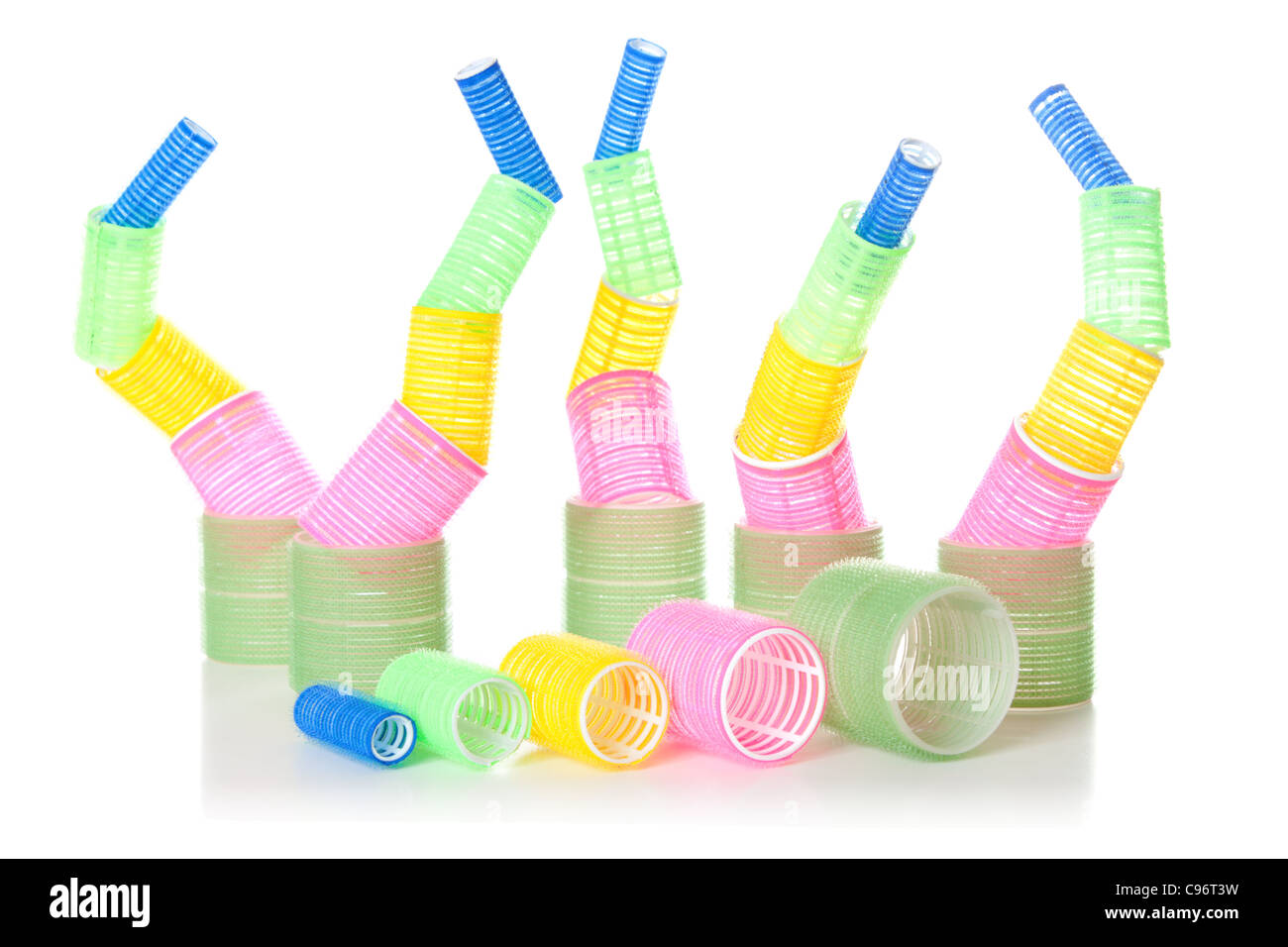 Multicolored hair curlers isolated over white background Stock Photo