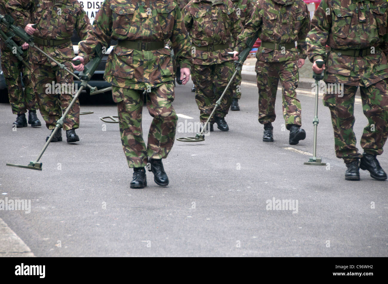 Lord Mayor's show. Bomb disposal soldiers in the procession walking with mine detection equipment Stock Photo