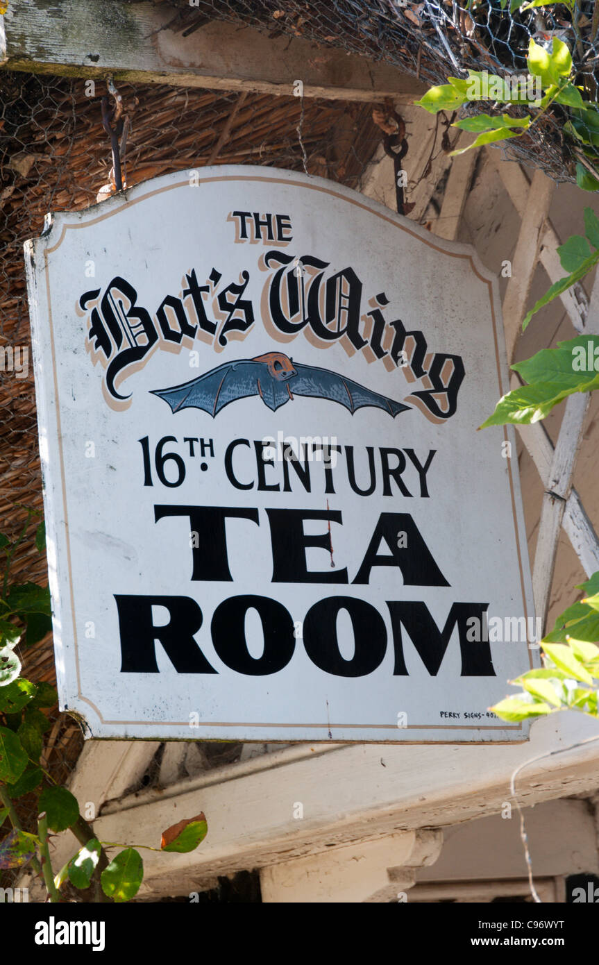 A sign for a tea room in a 16th century thatched cottage in the village of Godshill on the Isle of Wight Stock Photo