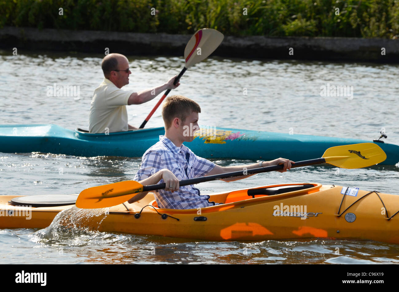 canoeing with no lifejackets Stock Photo