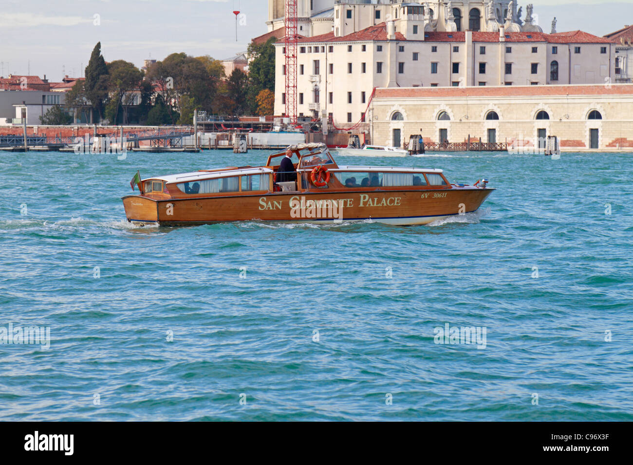 The San Clemente Palace private motor launch taking guests to St Marks square, Venice, Italy, Europe. Stock Photo