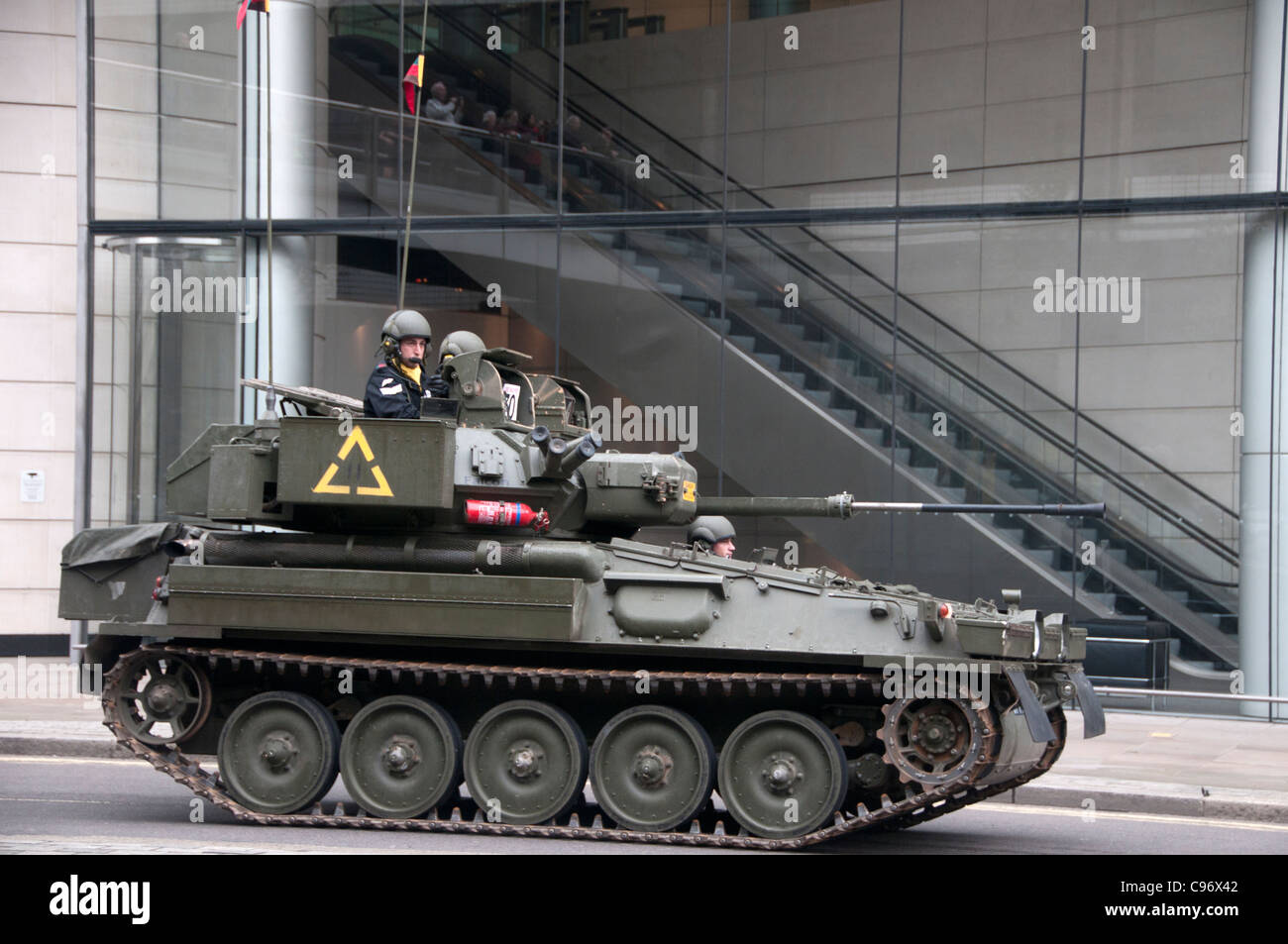Lord Mayor's show. A tank in the procession passes through the City , and the Museum of London Stock Photo