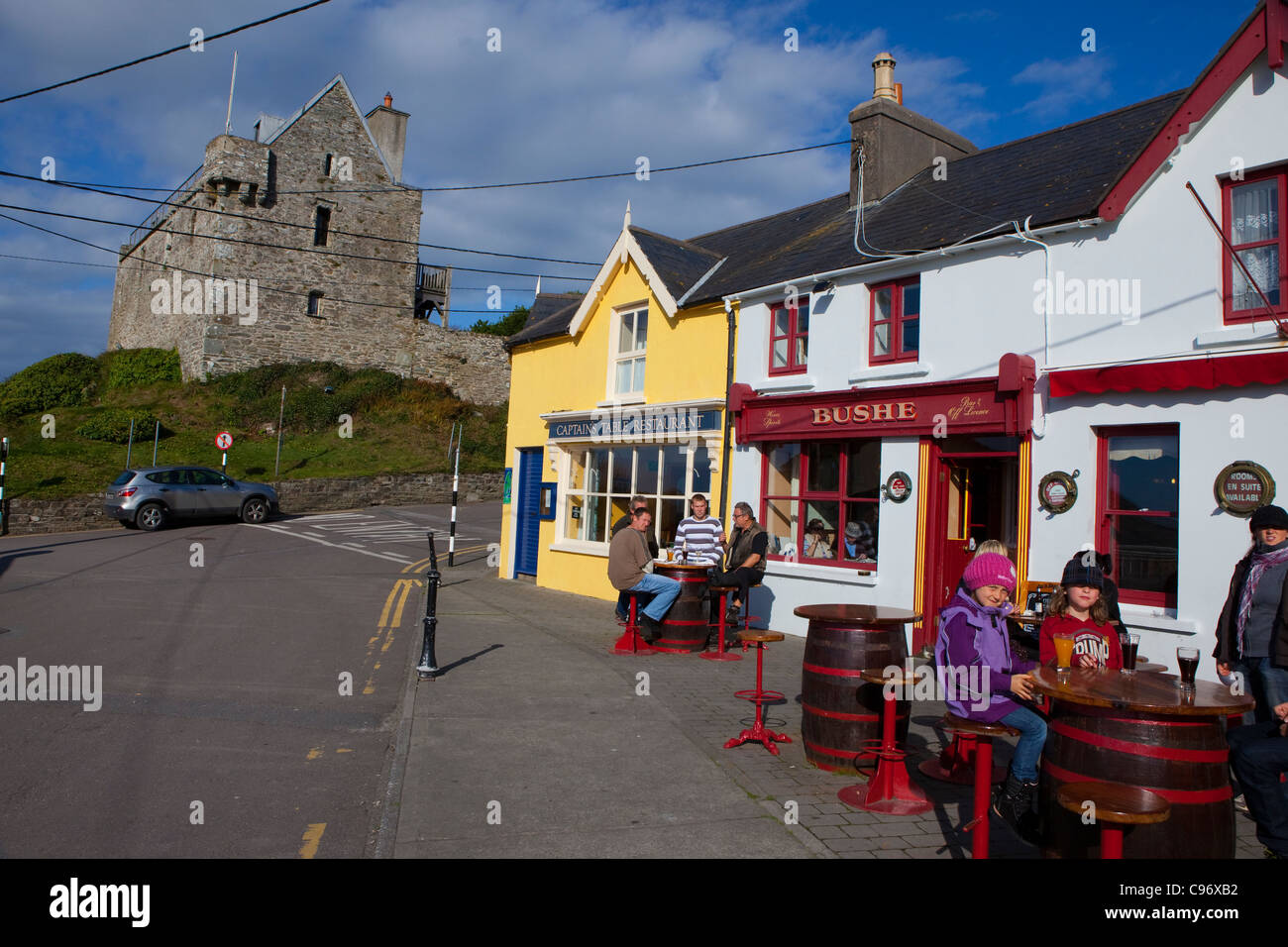 People outside Bushe's Bar in The fishing village of Baltimore, West Cork, Ireland Stock Photo