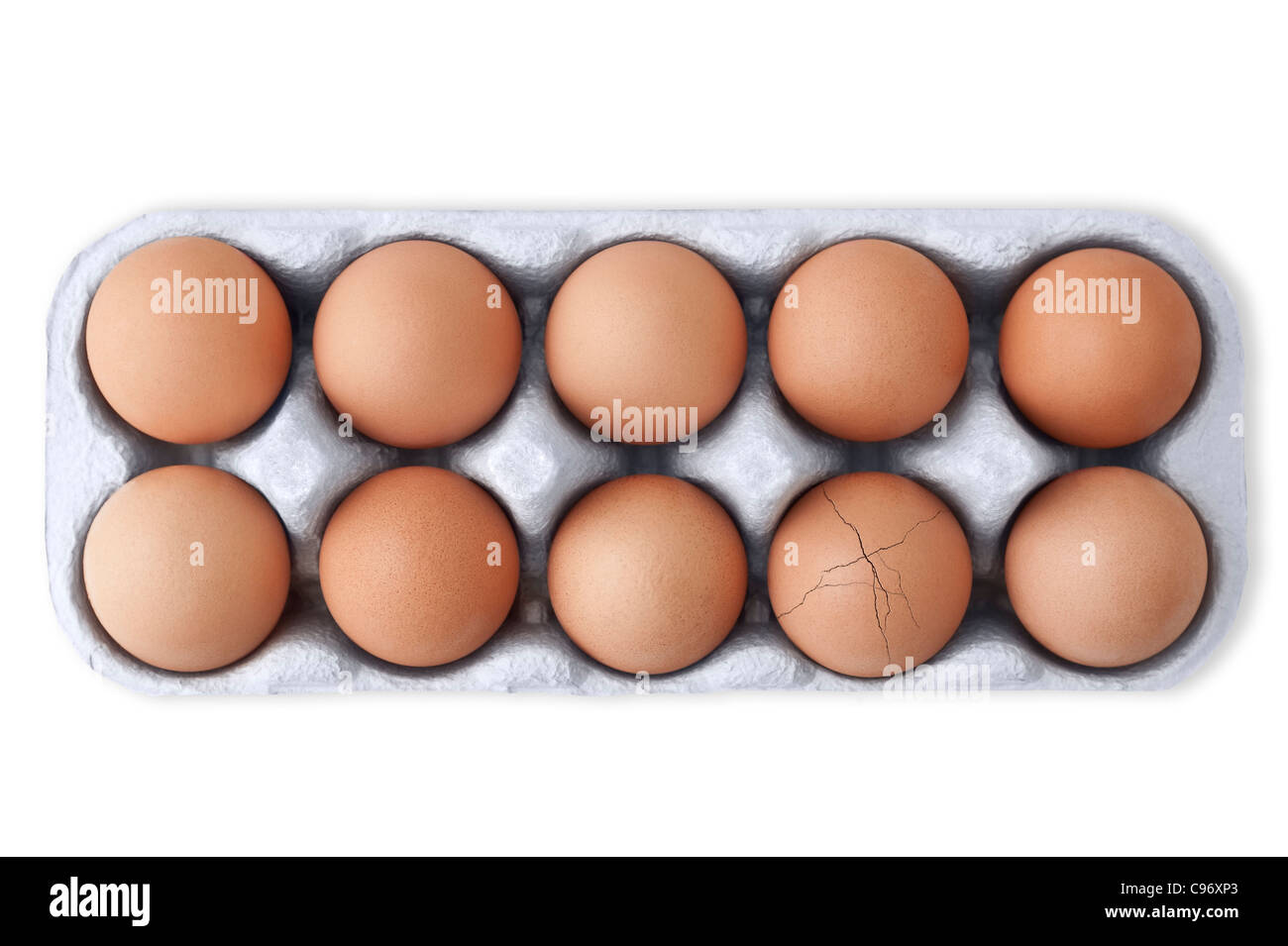 Box of ten eggs with one cracked egg on white background. Cutout Stock Photo