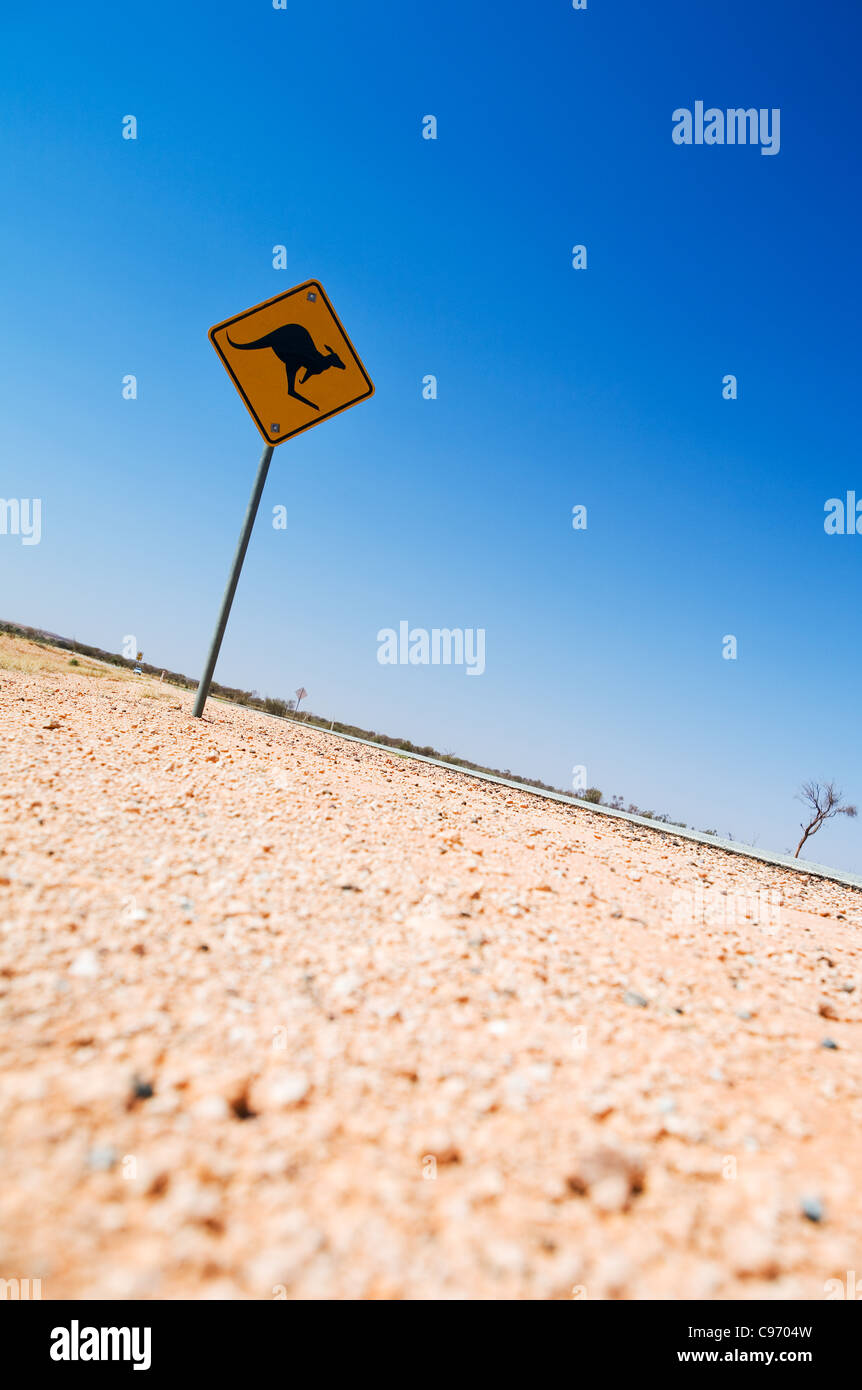 Kangaroo hazard sign on the highway, near Alice Springs, Northern Territory, Australia Stock Photo