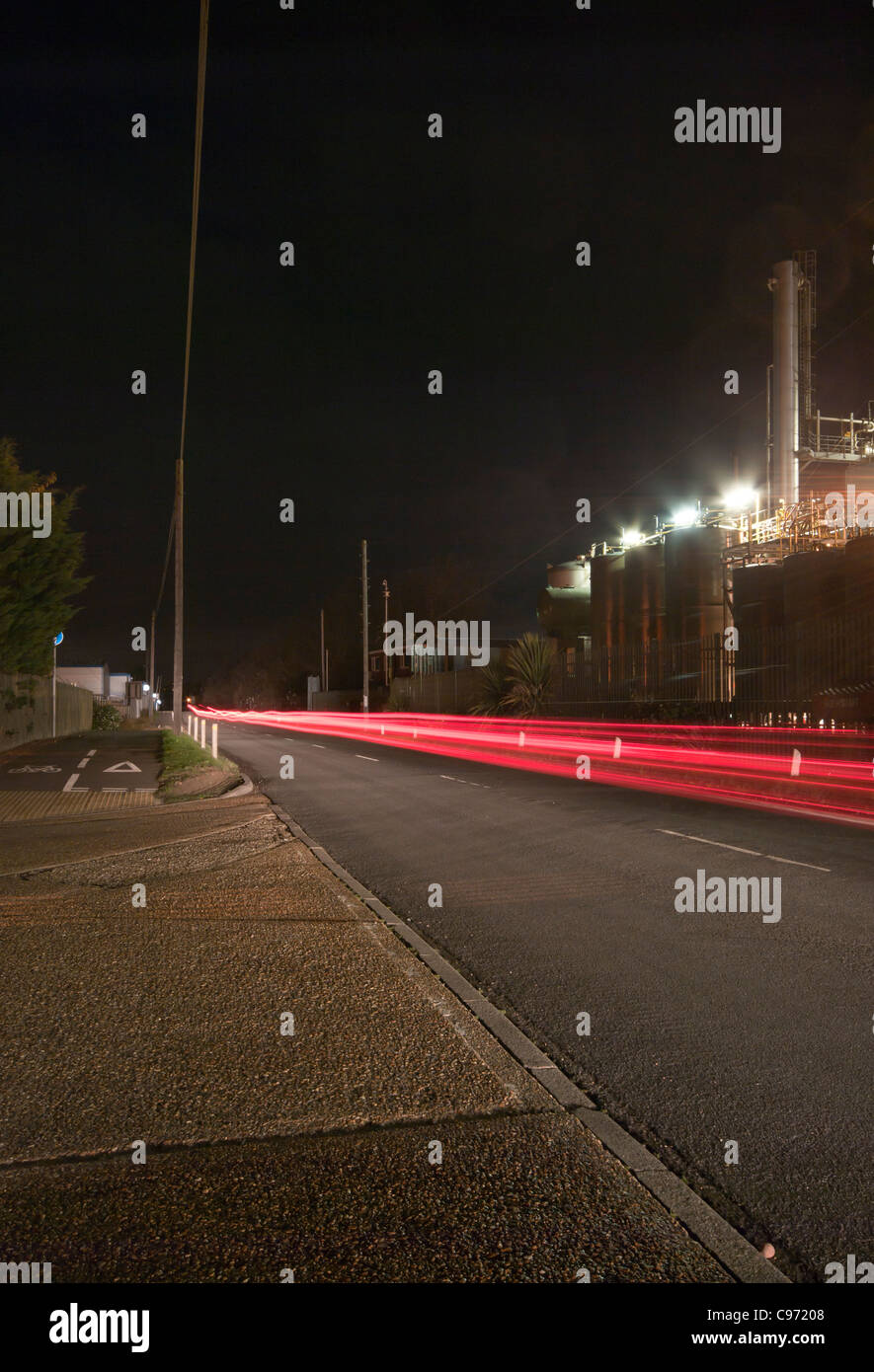 Red Traffic trails Rye Harbour Road Industrial Area At after dark night time East Sussex UK Stock Photo