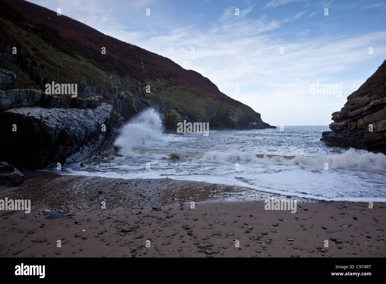 Waves breaking on rocks near Cwmtydu on the Ceredigion Coast, Wales Stock Photo