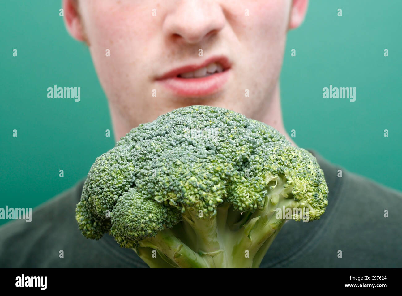 A man disliking broccoli Stock Photo
