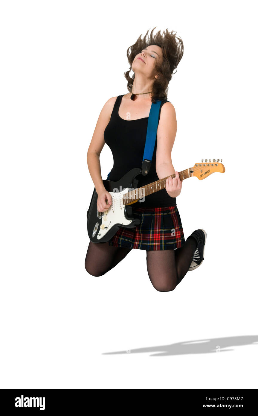 Female guitarist jumps Stock Photo
