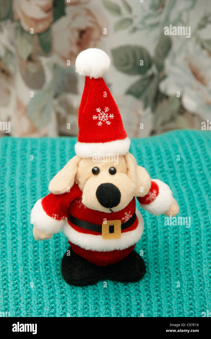 Father Christmas (Santa Clause) cuddly toy dog Stock Photo