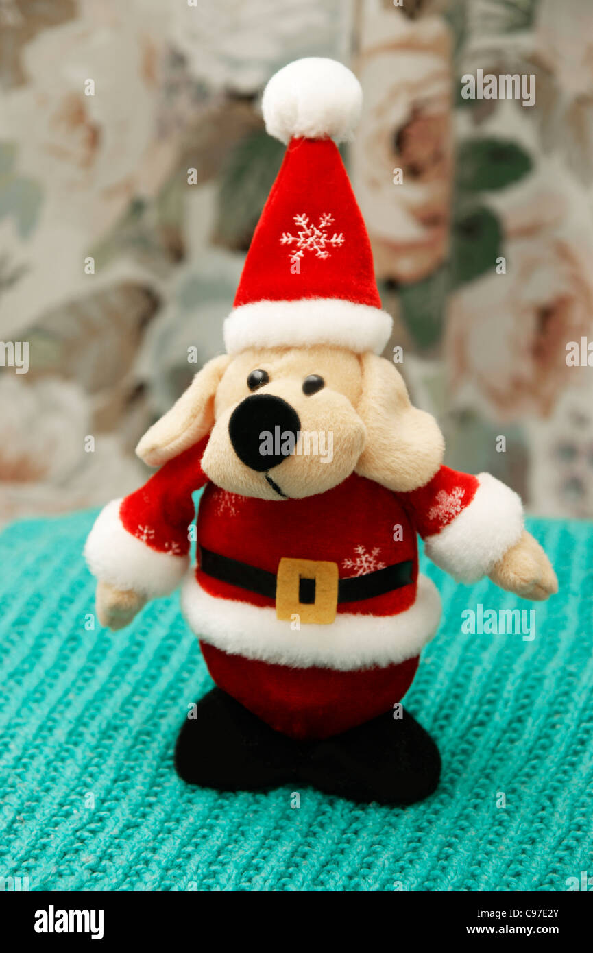 Father Christmas (Santa Clause) cuddly toy dog Stock Photo