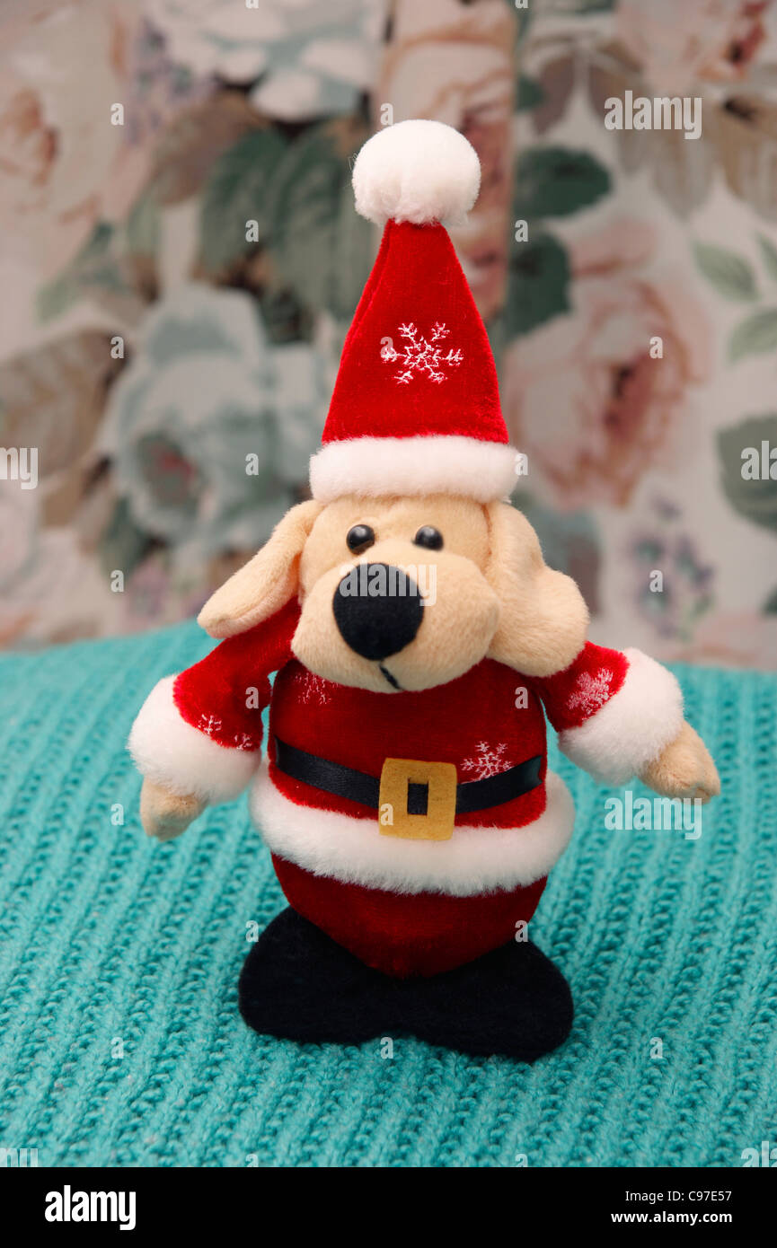 Father Christmas (Santa Clause) cuddly toy dog Stock Photo