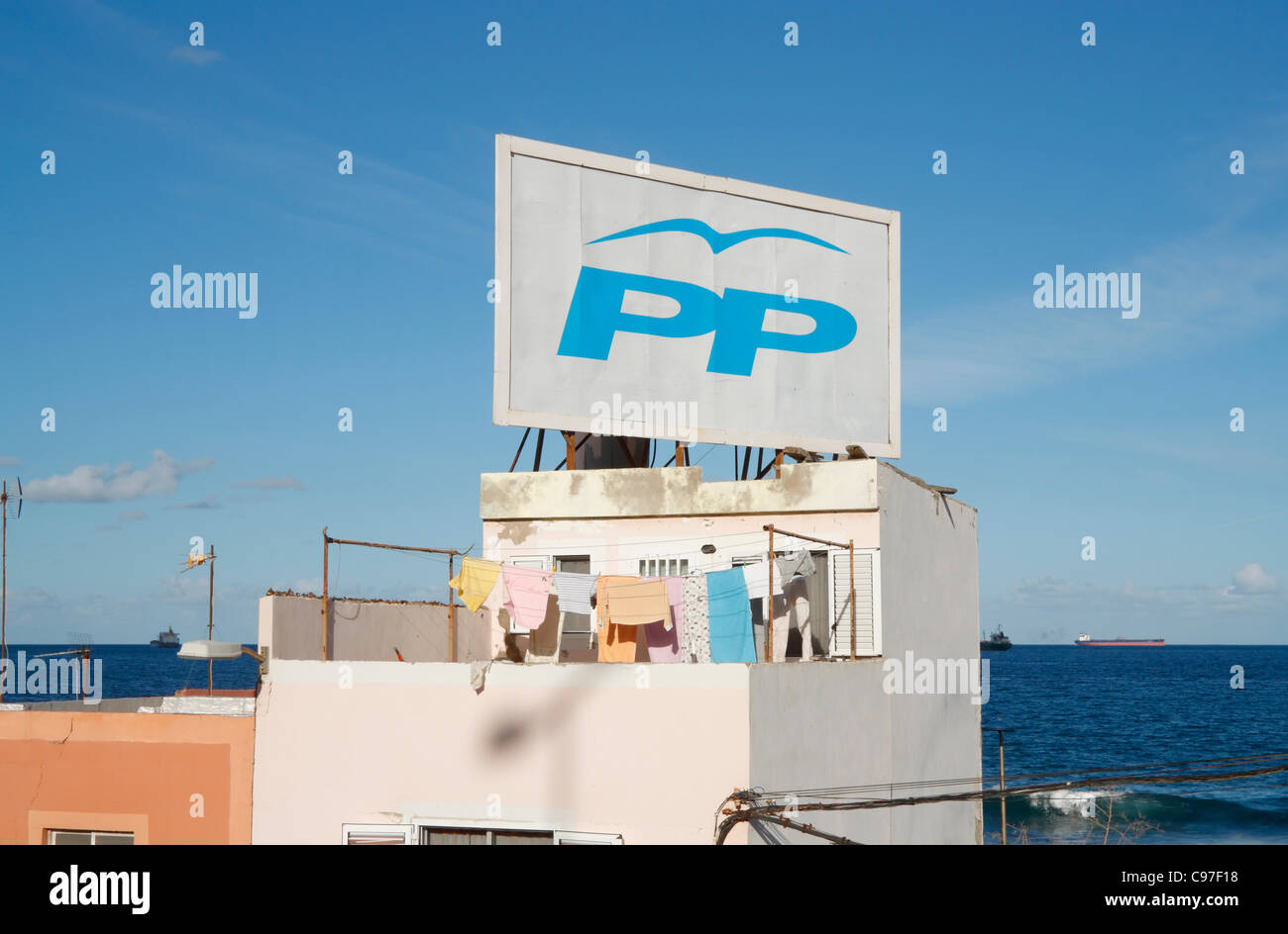 Las Palmas, Gran Canaria, Canary Islands, Spain, 15tth November 2011. Campaign billboard on house overlooking sea for Partido Popular (PP). Spanish general election is on 20th November 2011 Stock Photo