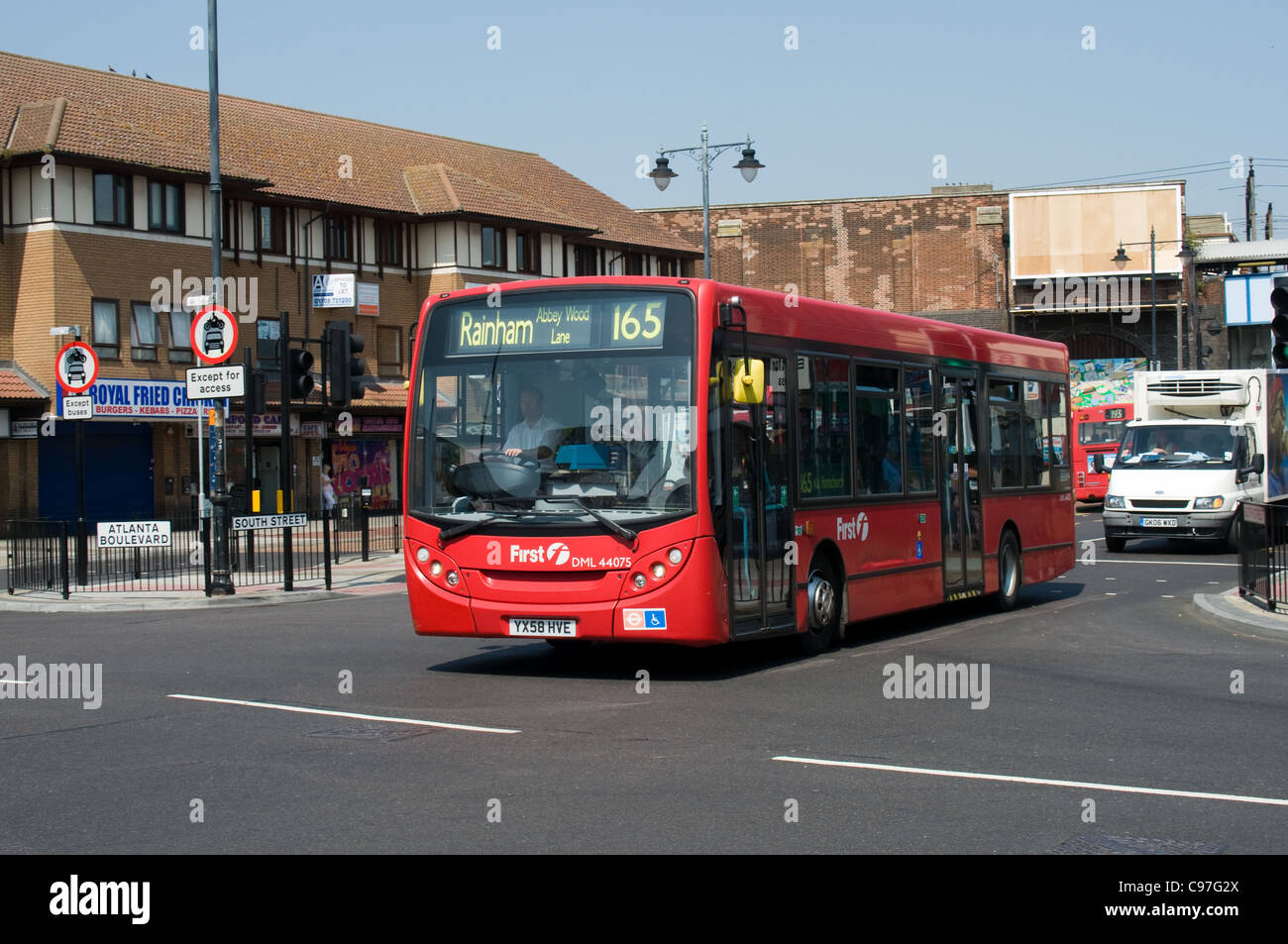 An Alexander Dennis Enviro 200 operated by First group passes along South Street, Romford. Romford Station is in the background. Stock Photo