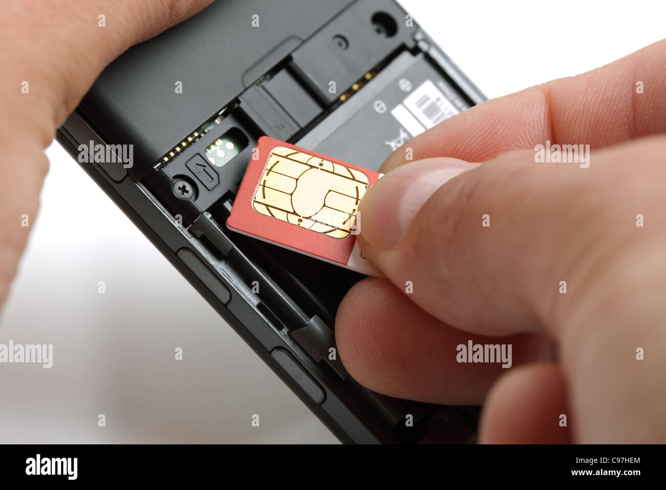 Inserting a sim card Stock Photo