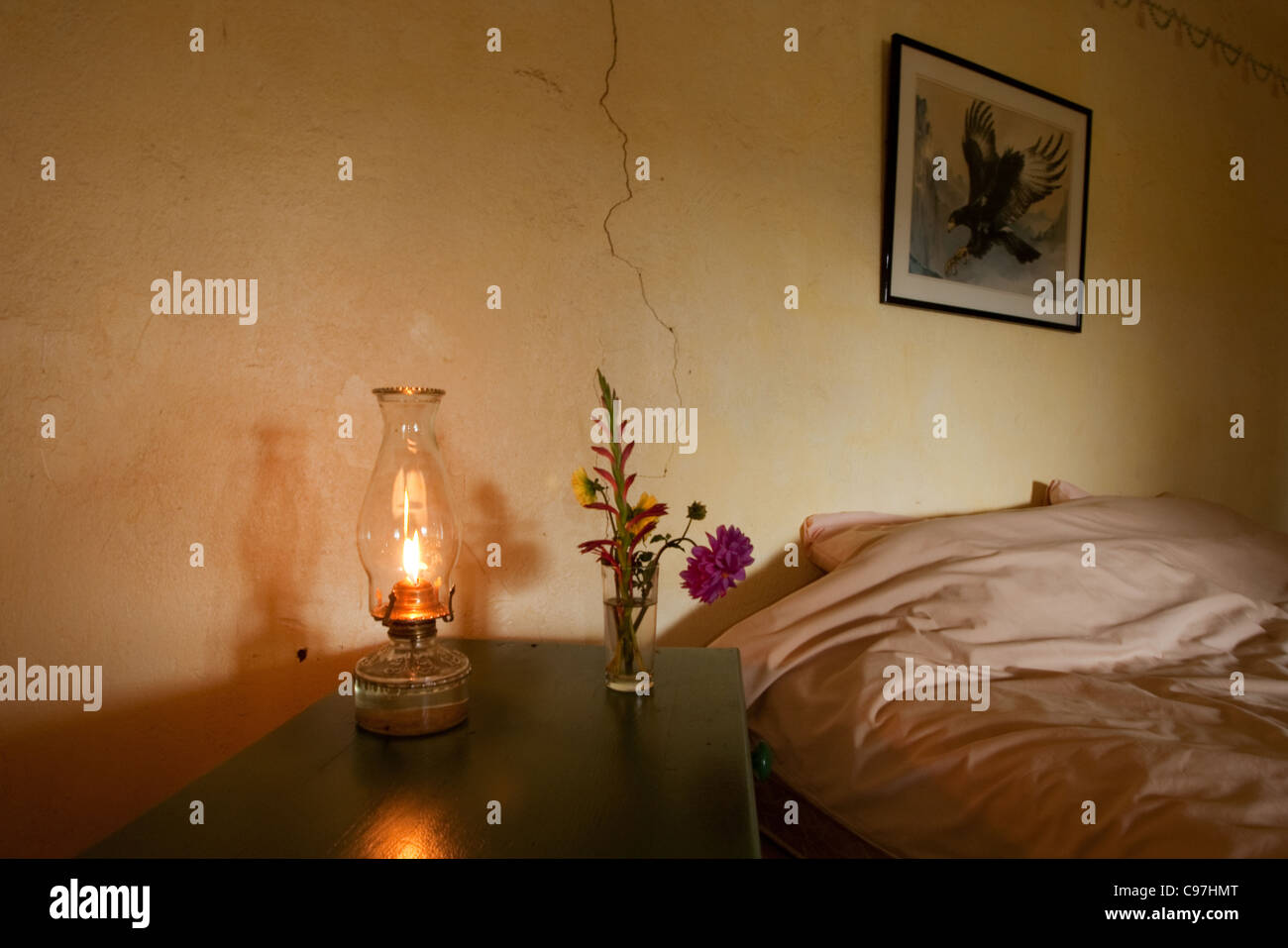Bedroom Interior With Old Fashioned Paraffin Lamp And Small