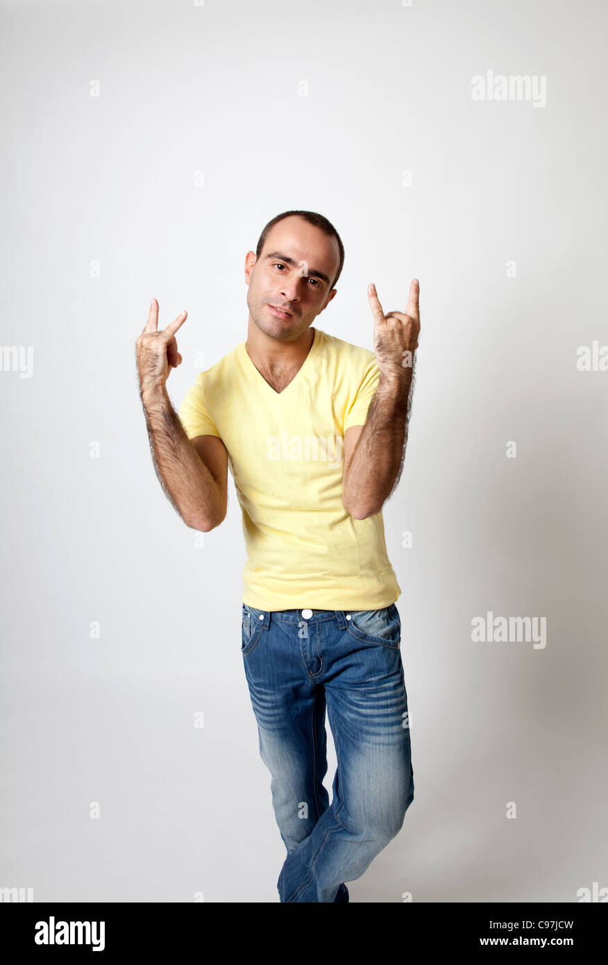 Man in casual clothing making hand gesture Stock Photo
