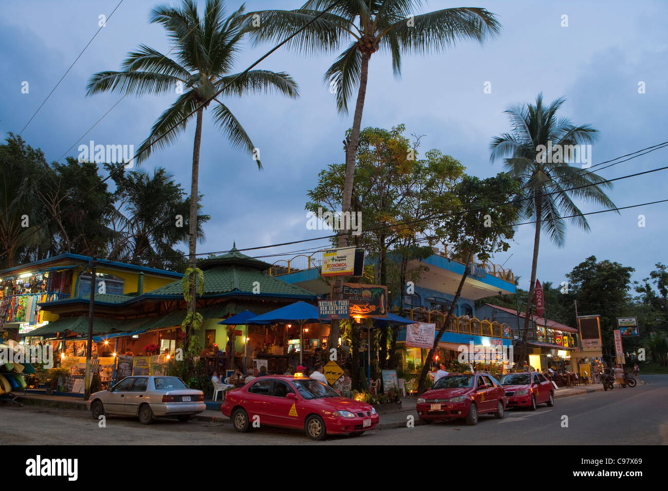 Taxis outside bars and restaurants at dusk, Manuel Antonio, Puntarenas