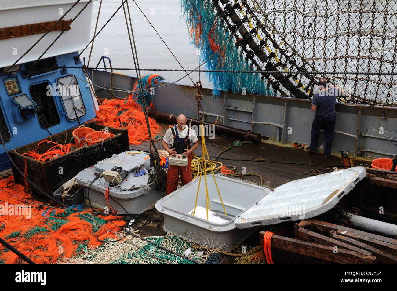 Men working on a commercial fishing trawler Milford Haven Port Nelson ...