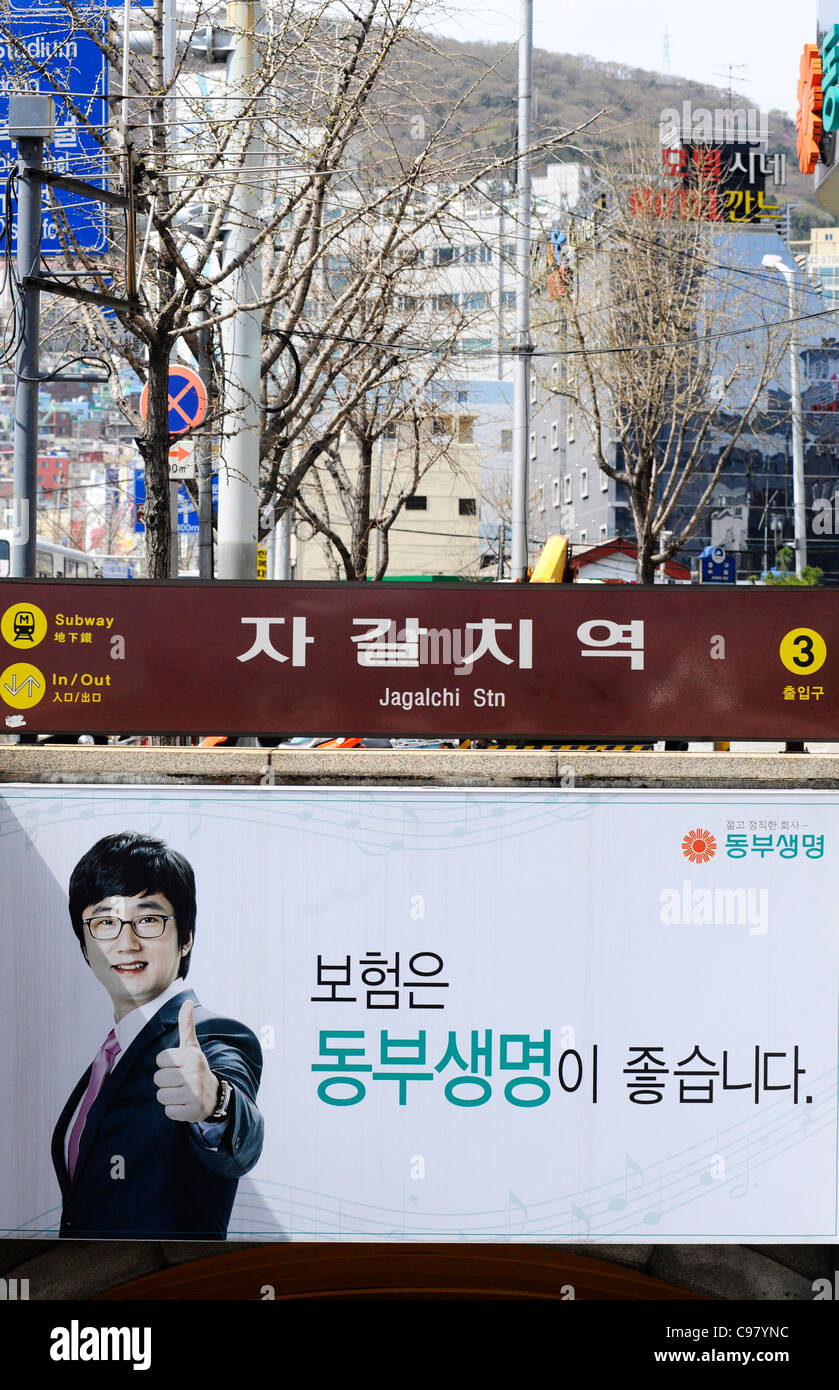 Sign for Jagalchi station over a poster in Busan, South Korea. Stock Photo