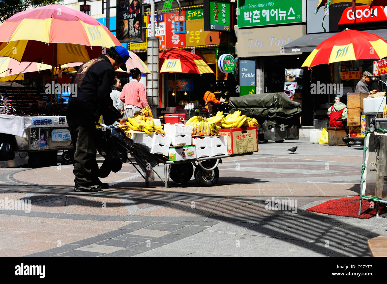 A man selling fruit in Busan, South Korea. Stock Photo