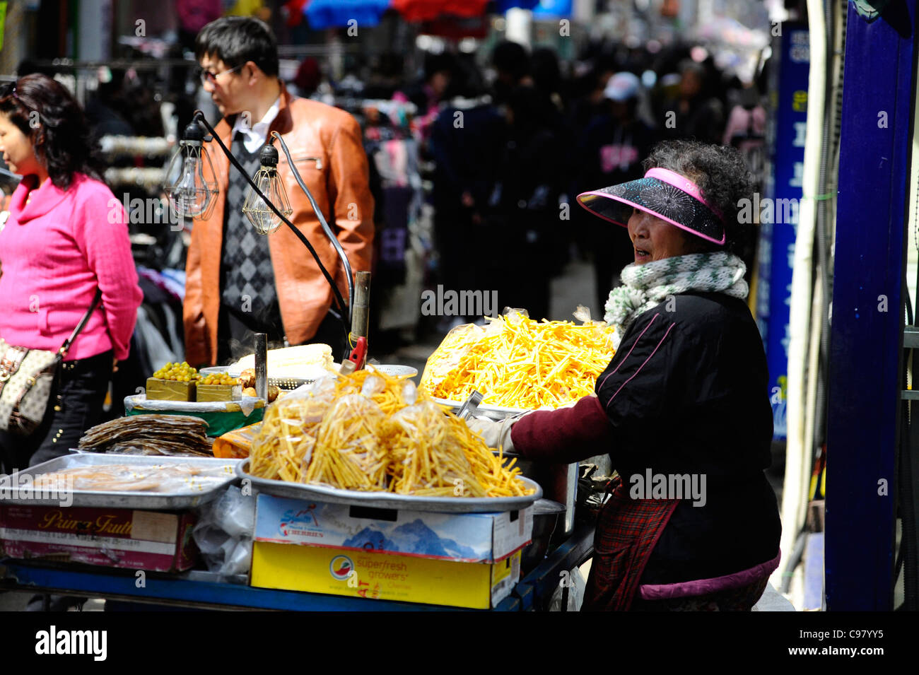 Woman selling hot street food in Busan, South Korea. Stock Photo