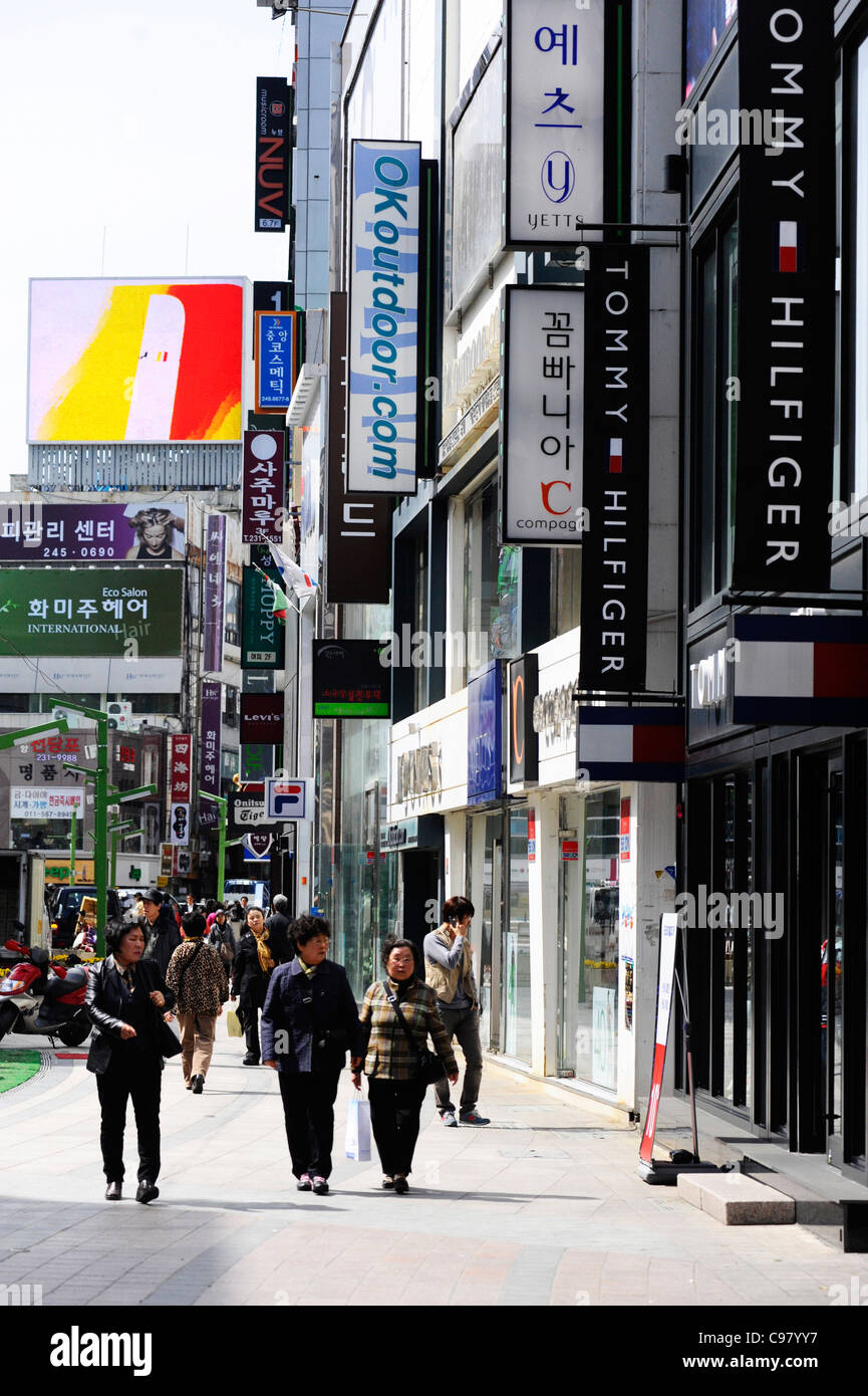 A busy street with designer shops in Busan, South Korea. Stock Photo