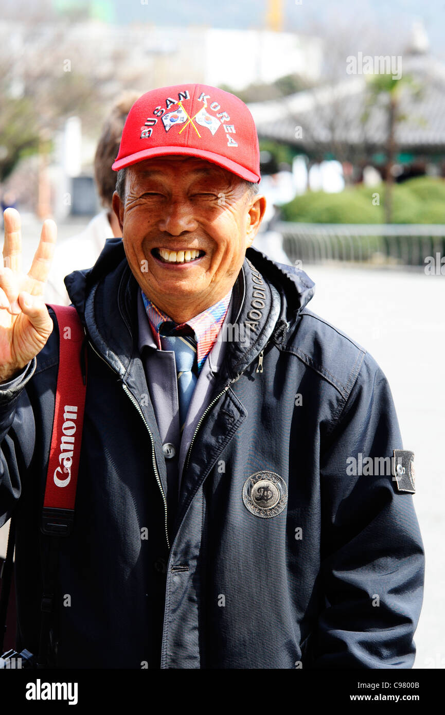 A friendly tourist photographer in Yongdusan Park, Busan, South Korea. Stock Photo