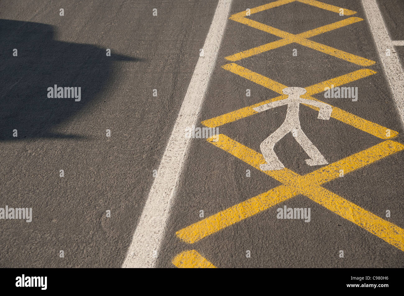 A safe zone for pedestrians to walk marked out on the ground with an icon, UK Stock Photo