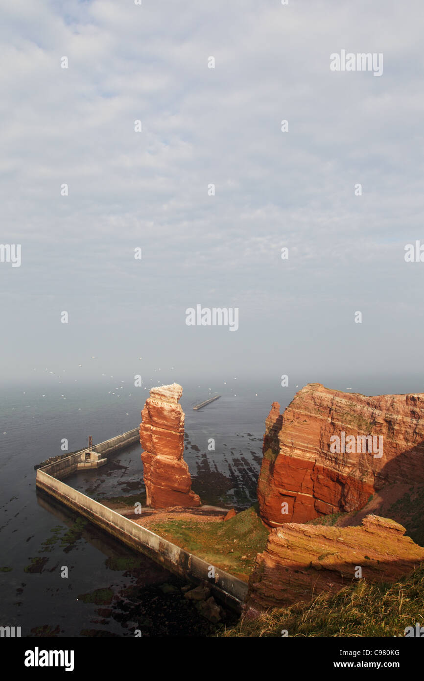 Cliff line of Helgoland with the Tall Anna, the landmark of Helgoland. Stock Photo