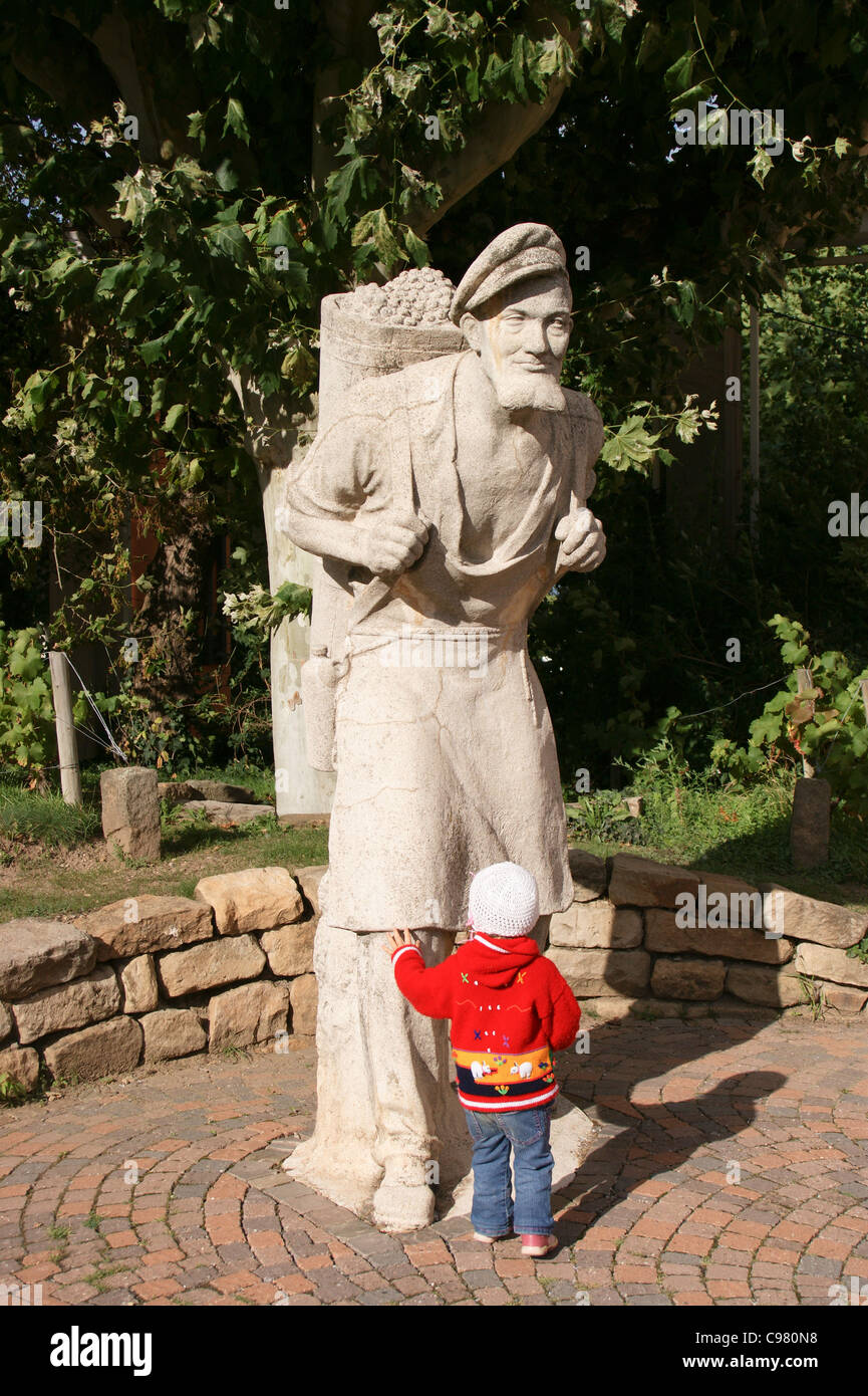 Statue of a grape-picker, with a small child Bad Durkheim, Rheinland-Pfalz, Germany Stock Photo
