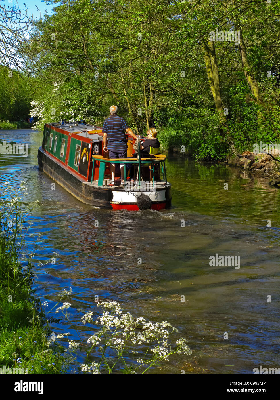 Narrowboat cruising on Staffordshire and Worcestershire Canal in Stafford West Midlands England UK built 1771 by James Brindley Stock Photo