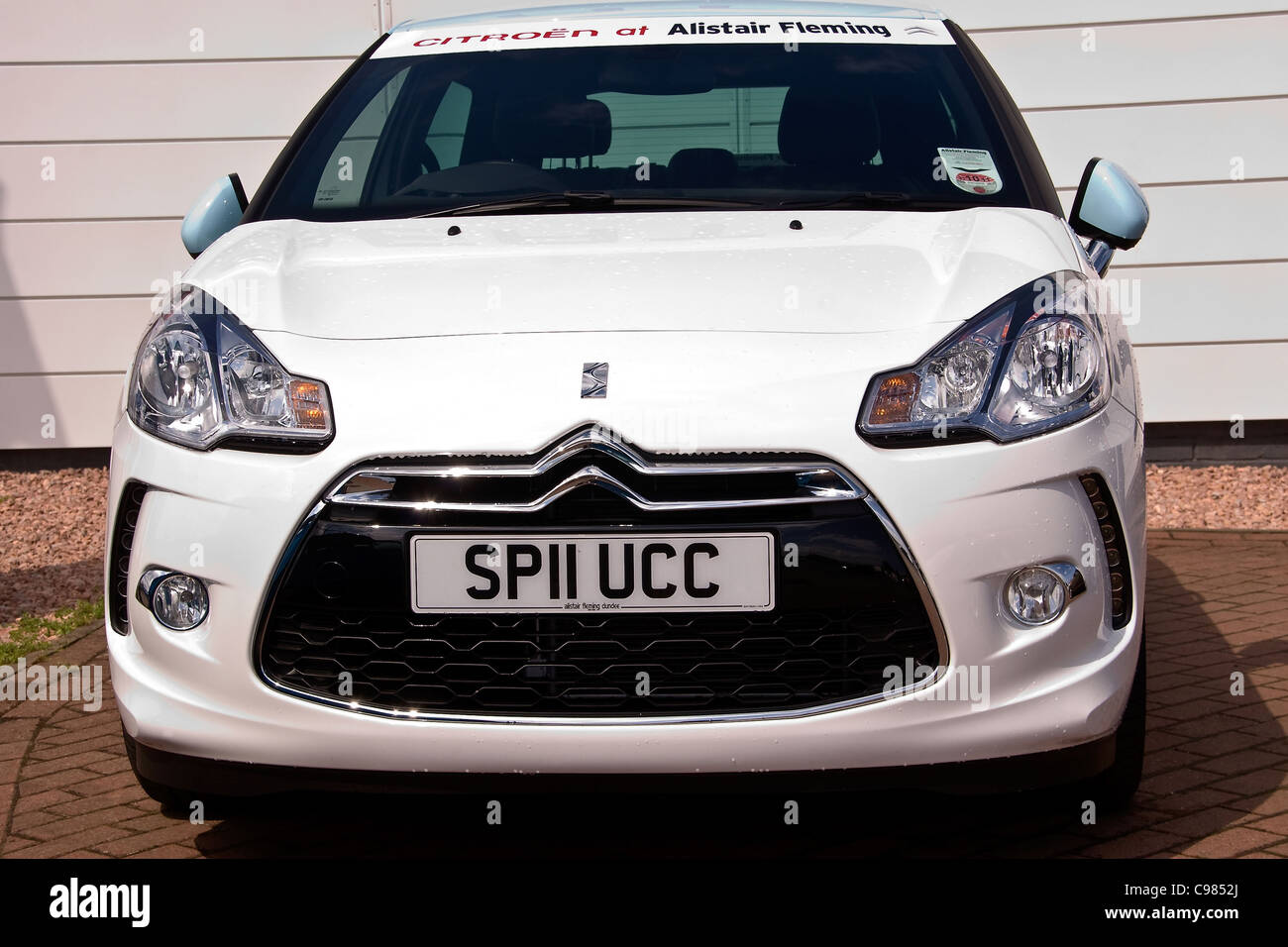 A new white Citroen with private registration number plate on display at the Alistair Fleming car dealer in urban Dundee , UK Stock Photo