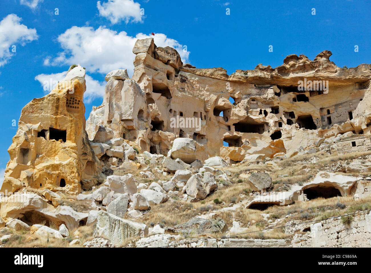 relics ruins of old cave village habitat of humans carved from limestone and sandstone hills, landscape, copy space crop margins Stock Photo