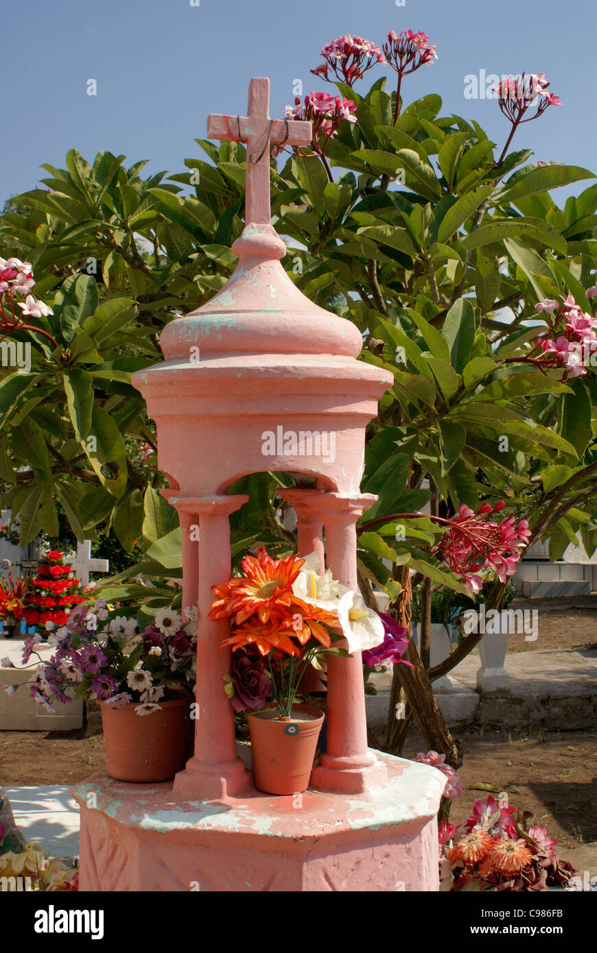 Grave decorated with flowers in the town cemetery for Dia de los Muertos, El Quelite near Mazatlan, Sinaloa, Mexico Stock Photo