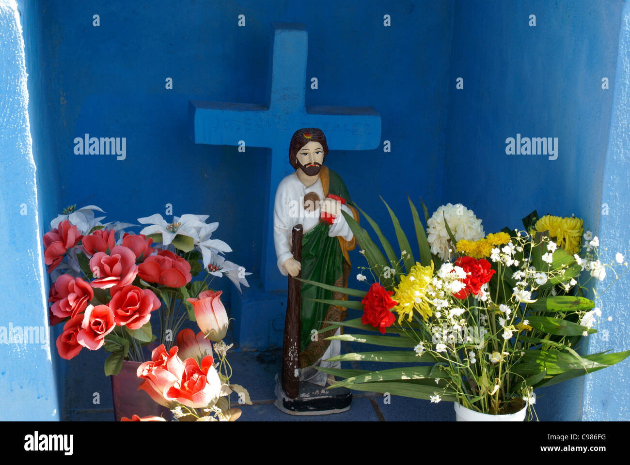 Grave decorated with flowers in the town cemetery for Dia de los Muertos, El Quelite near Mazatlan, Sinaloa, Mexico Stock Photo