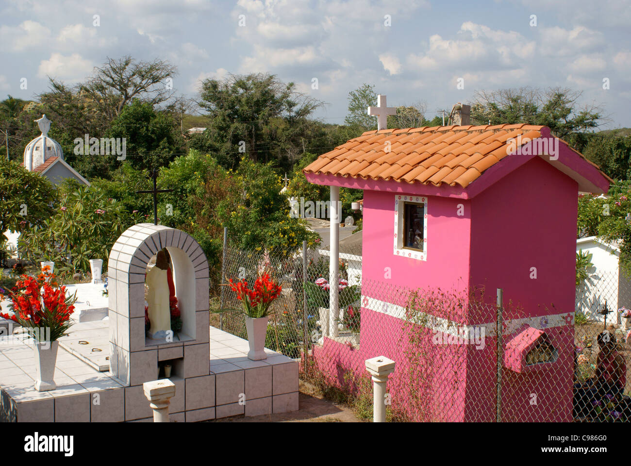 Colorful mausoleums in the town cemetery decorated for Dia de los Muertos, El Quelite near Mazatlan, Sinaloa, Mexico Stock Photo