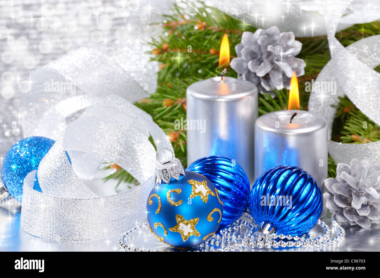 Blue Christmas balls with silver candles over bright background Stock Photo  - Alamy