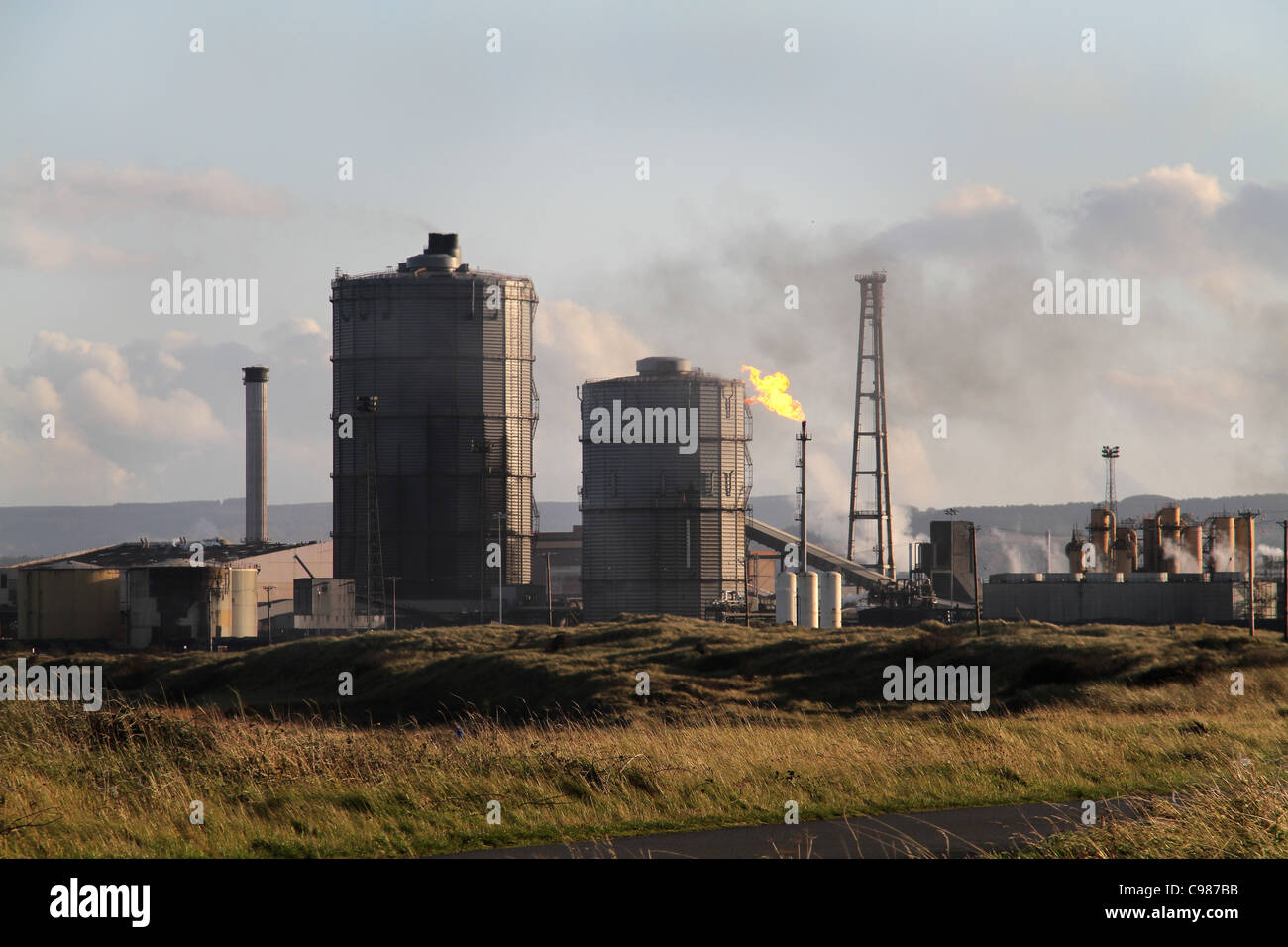 Gas flare and holders at coke oven plant Stock Photo Alamy