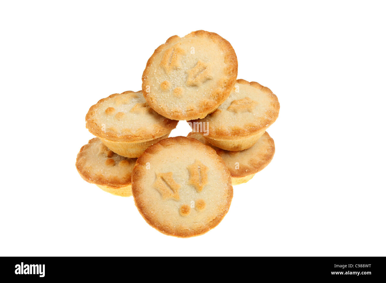 Group of Christmas holly themed mince pies isolated against white Stock Photo