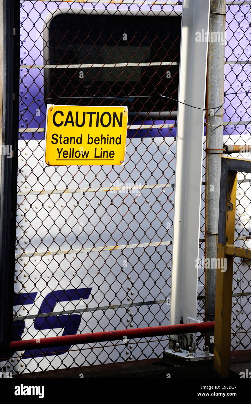 Stand behind the yellow line, sign hires stock photography and images