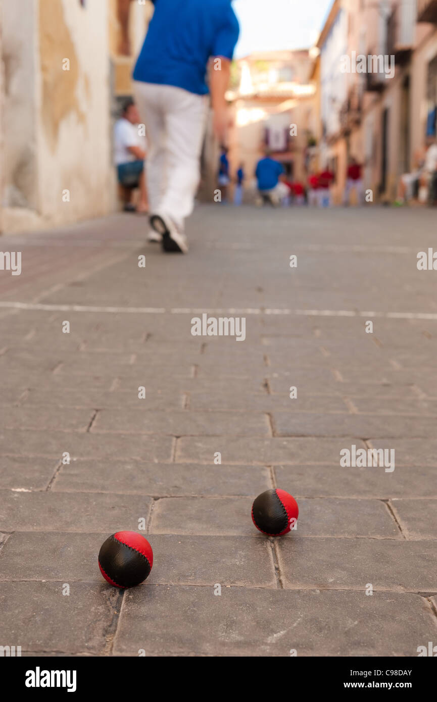 Traditional Spanish pelota game being played on a cobblestone village street Stock Photo