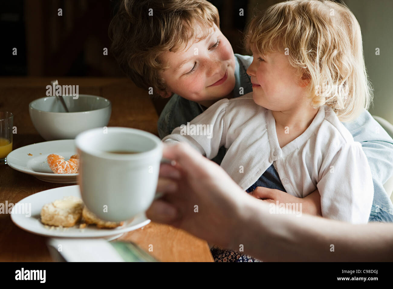 Brother and sister having breakfast Stock Photo