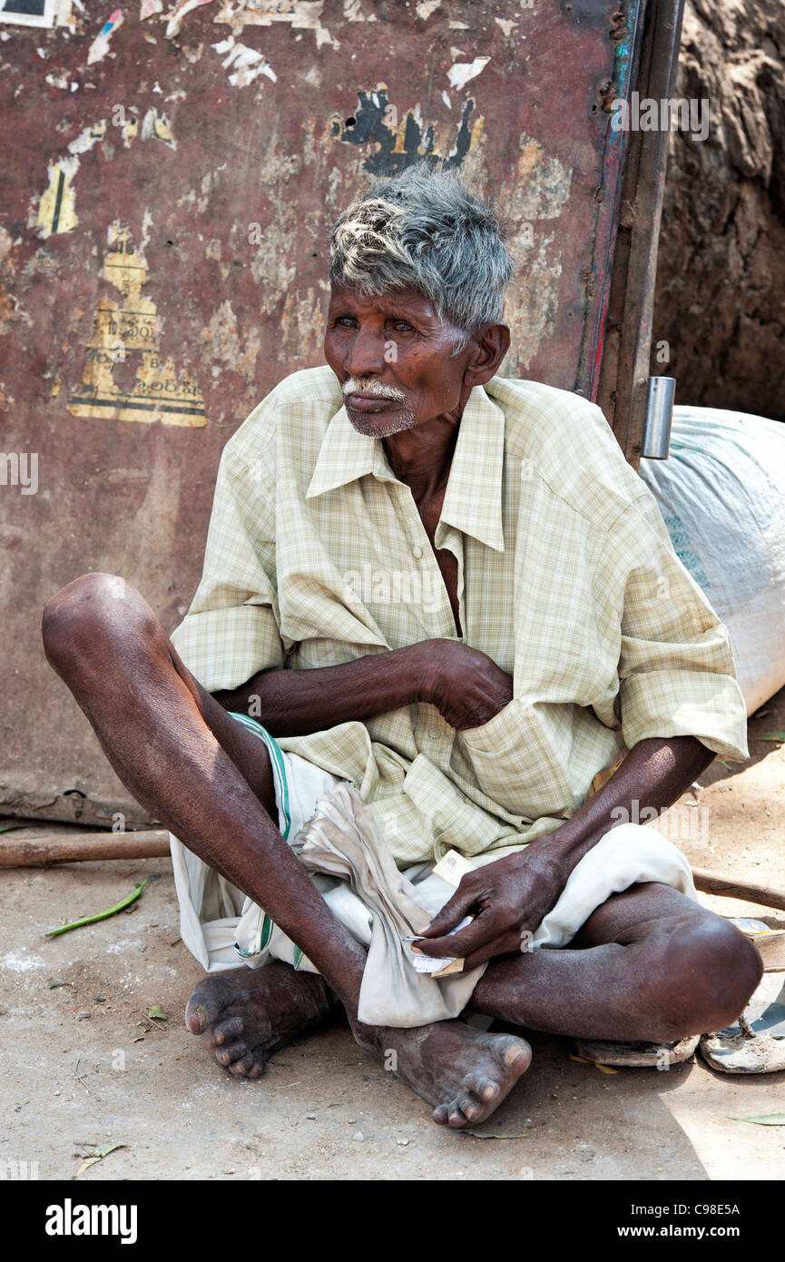 Old Indian man sitting on the street. Andhra Pradesh, India Stock Photo