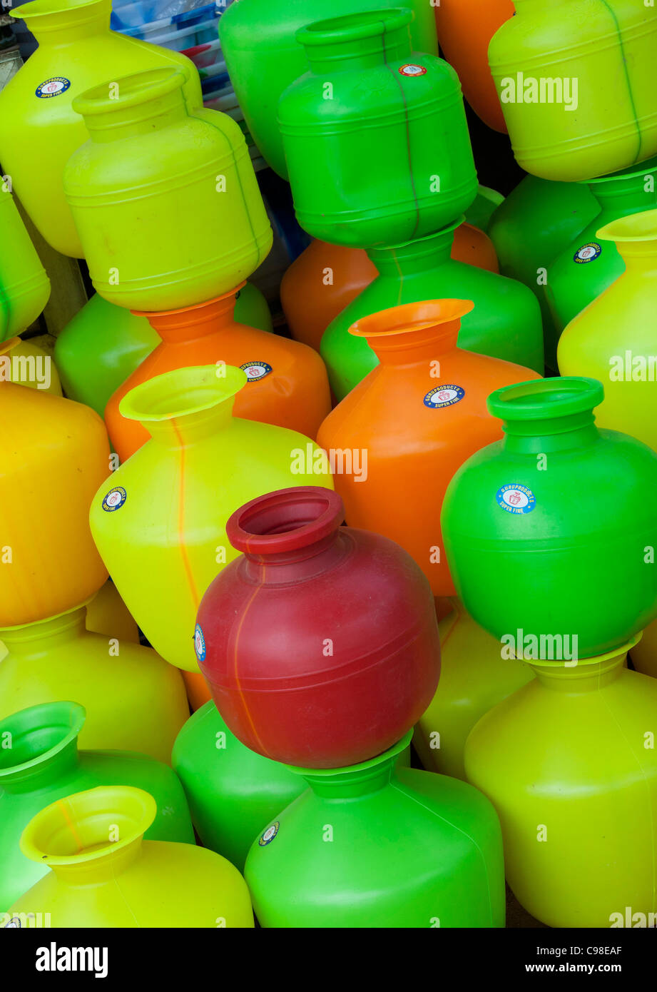Colourful plastic indian water carrying pots. India Stock Photo - Alamy