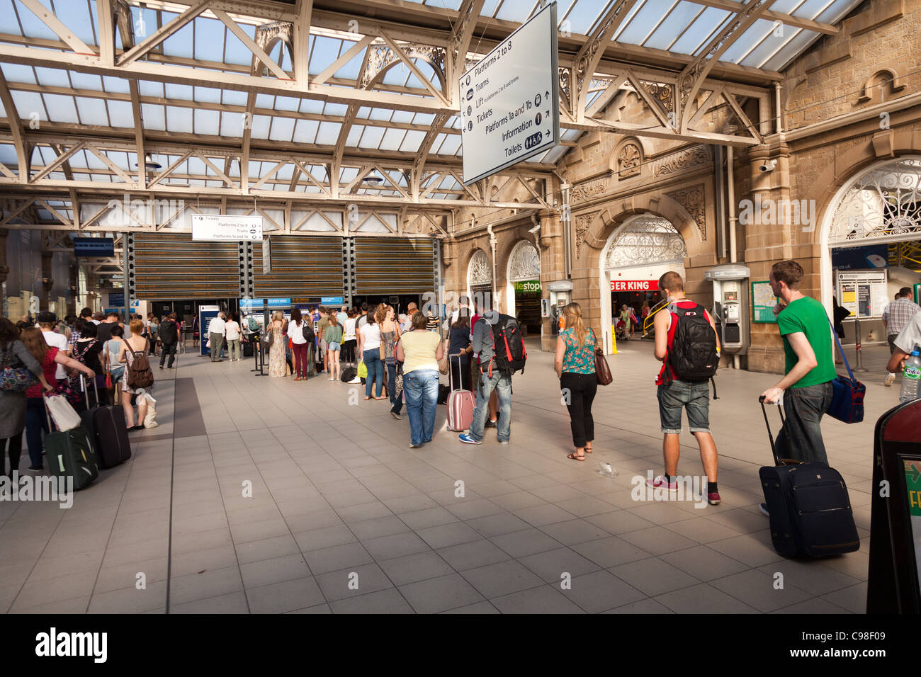 Students queuing for train tickets at Sheffield station a couple of