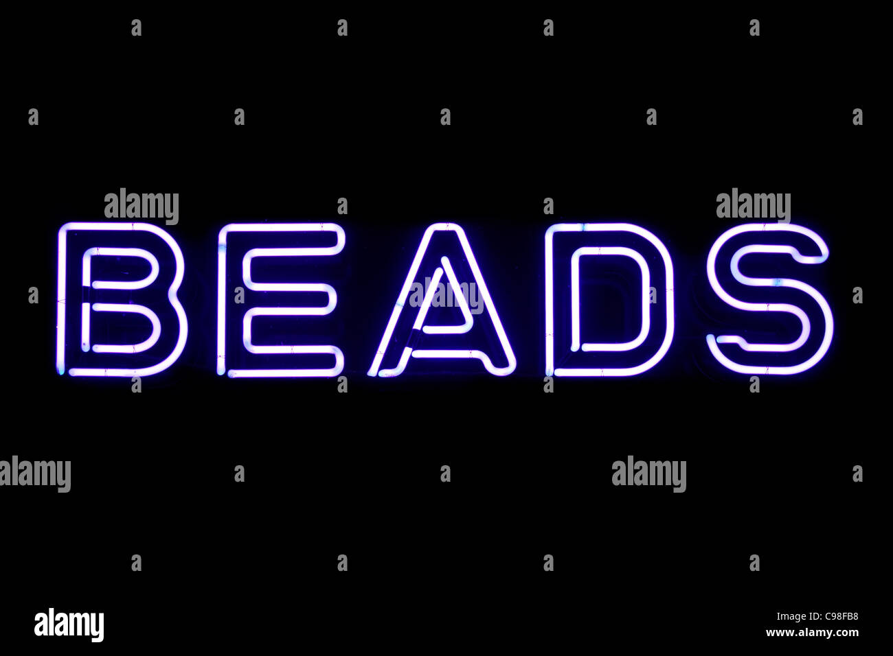 Purple beads neon sign isolated on black background Stock Photo
