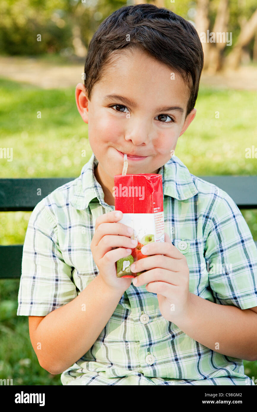 Boy drinking from juice carton, portrait Stock Photo