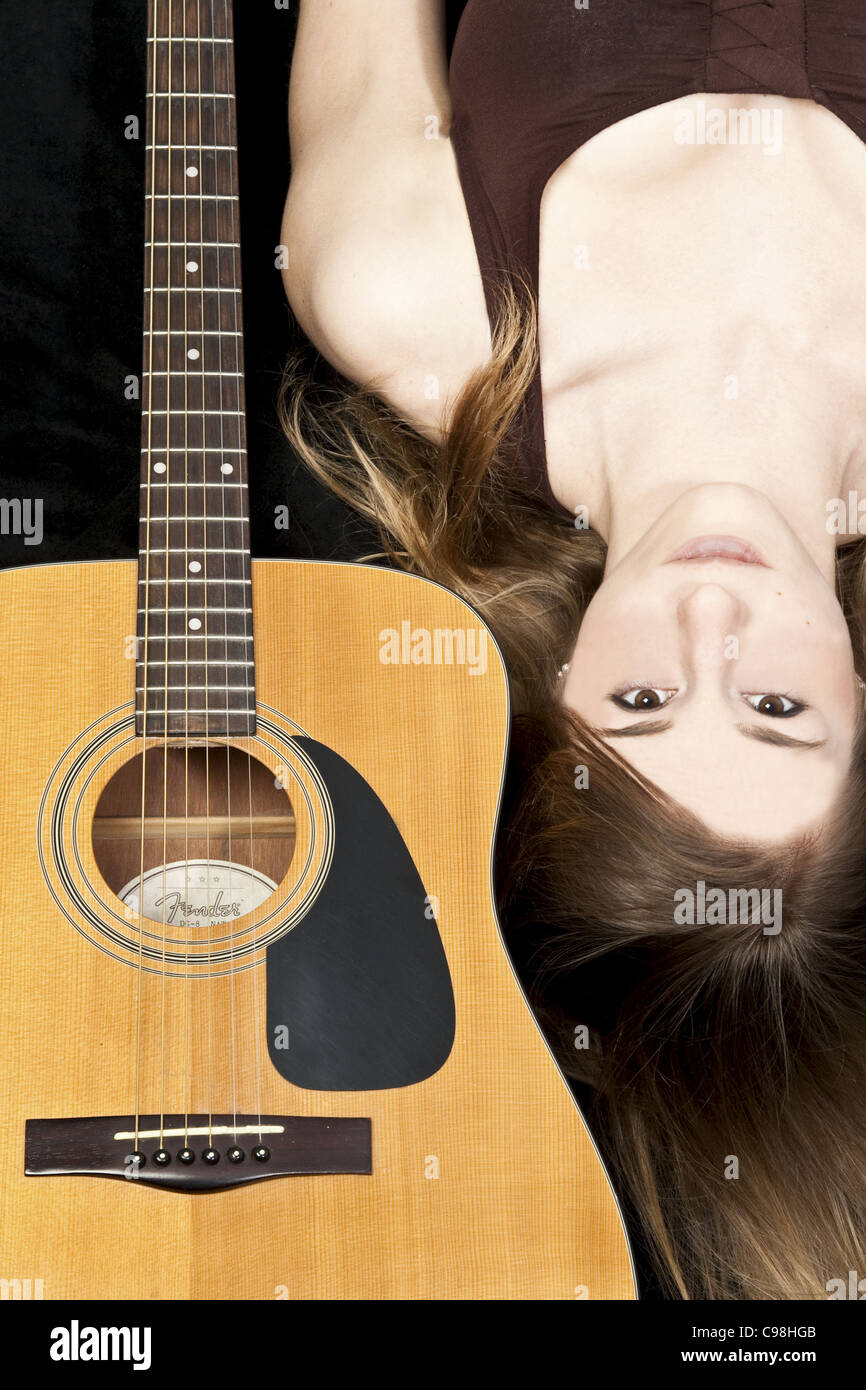 Colour Portrait of a young girl with a Fender Acoustic Guitar Stock ...